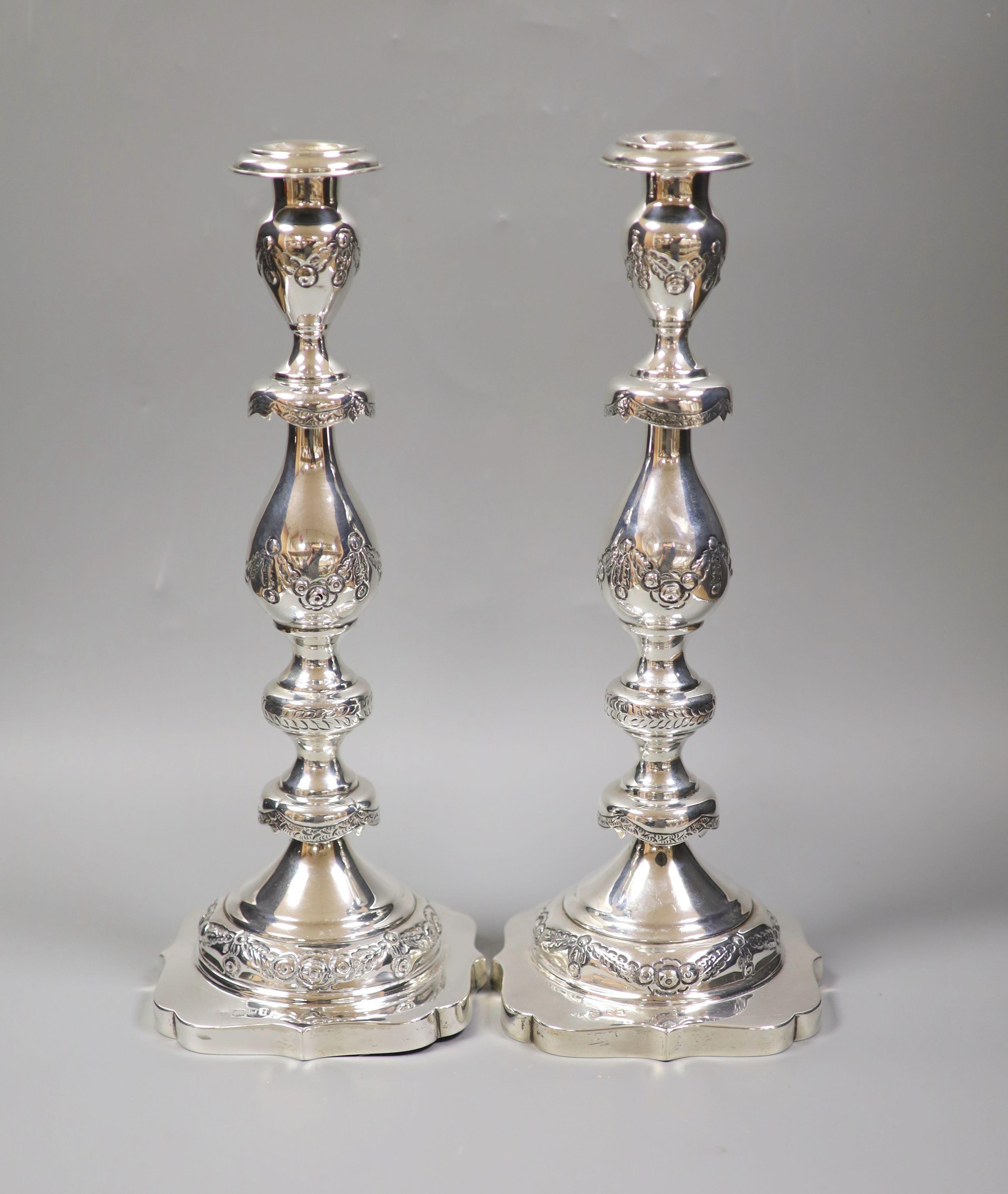 A pair of George V silver Sabbath Day candlesticks, Morris Salkind?, London, 1921, 36.9cm